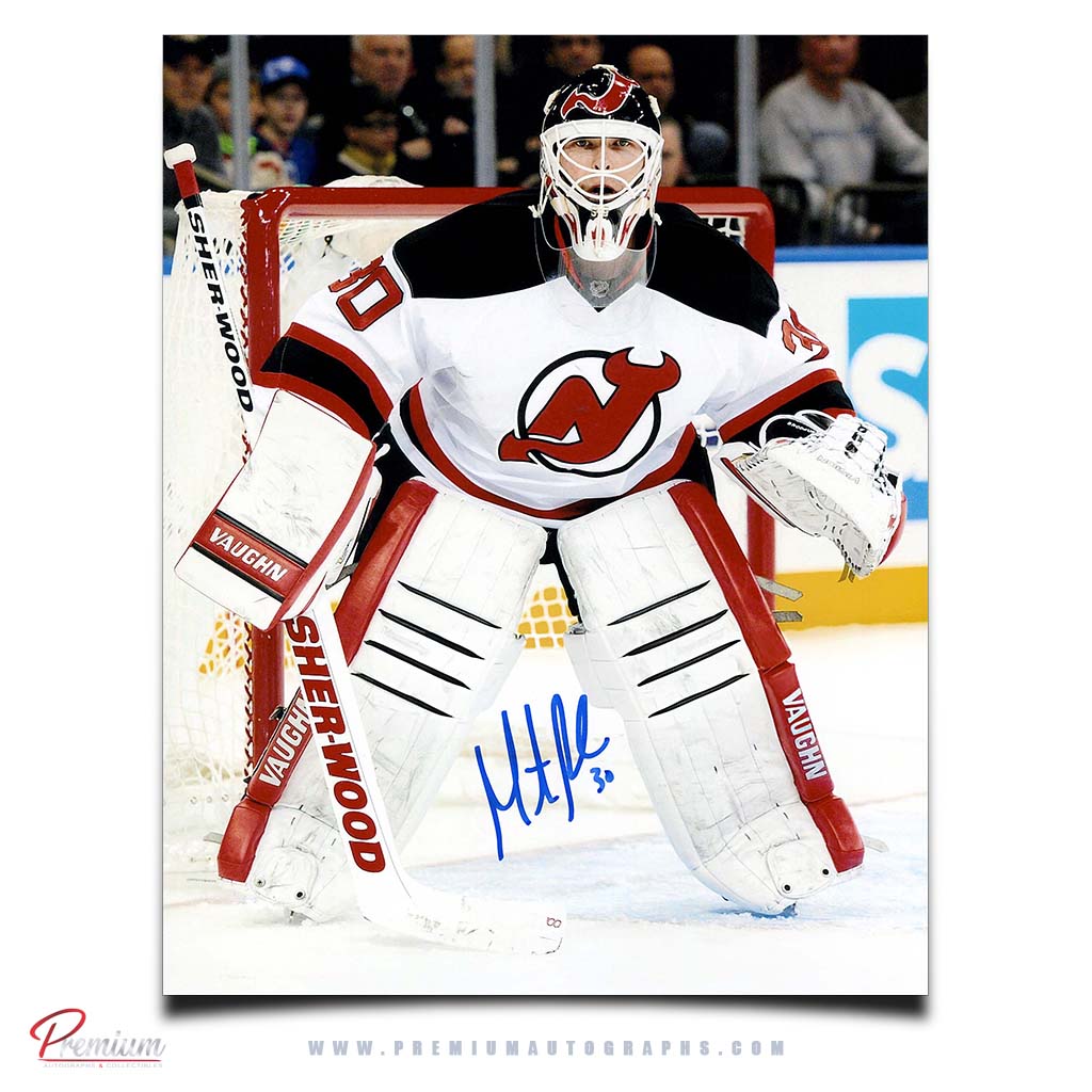 Martin Brodeur New Jersey Devils Autographed 8x10 Photograph Against the Post. 