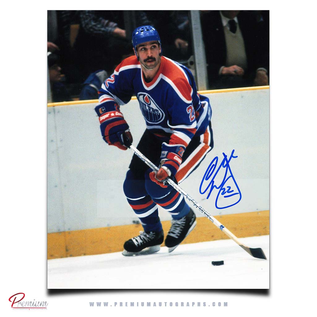 Charlie Huddy Edmonton Oilers Autographed 8x10 Photograph with the Puck Along the Boards