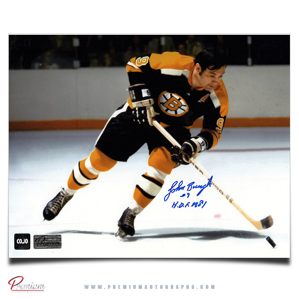John Bucyk Boston Bruins Autographed 8x10 Photograph With the Puck w/ HOF 1981 Inscription