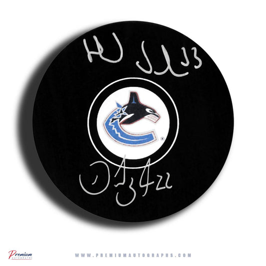 Henrik & Daniel Sedin Vancouver Canucks Signed Puck