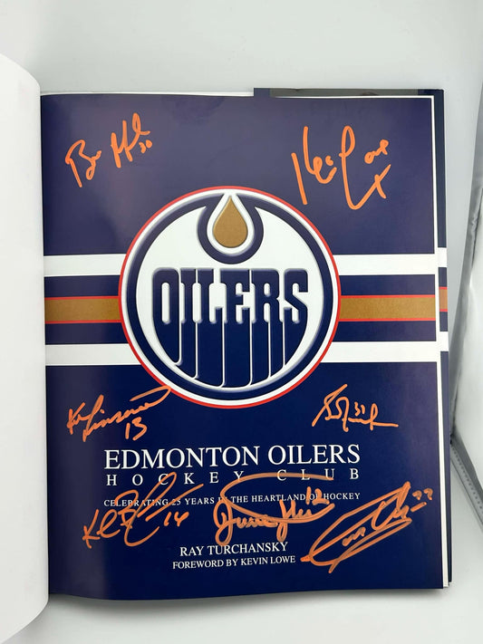 Edmonton Oilers Hockey Club by Ray Turchansky Autographed by Bill Ranford, Dave Hunter, Kevin Lowe, Ken Linesman, Grant Fuhr, Kelly Buchberger & Garry Unger orange paint pen