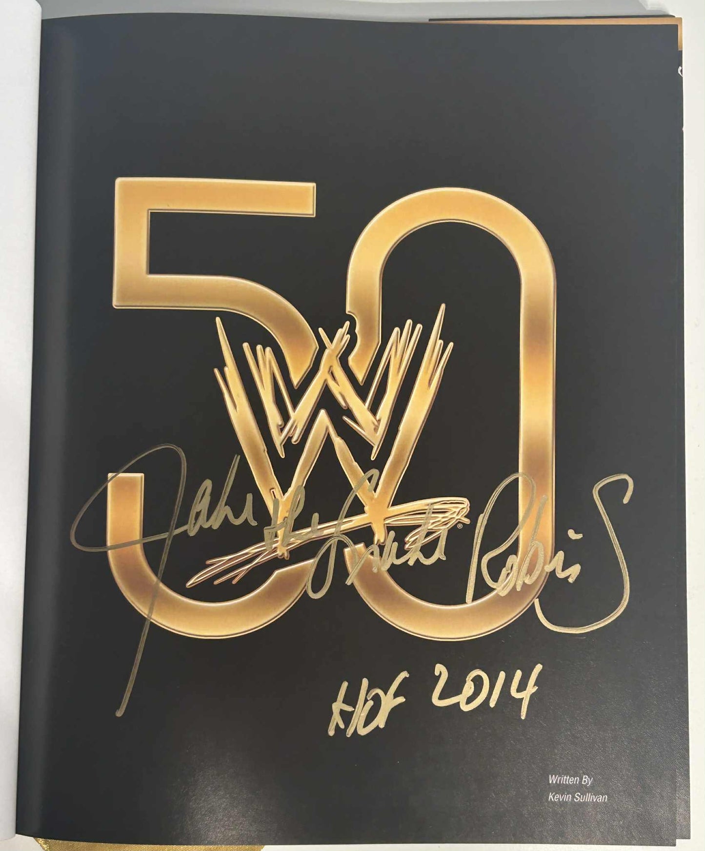 Celebrating 50 Years of Sports Entertainment WWE Autographed Book by Jake the Snake Roberts