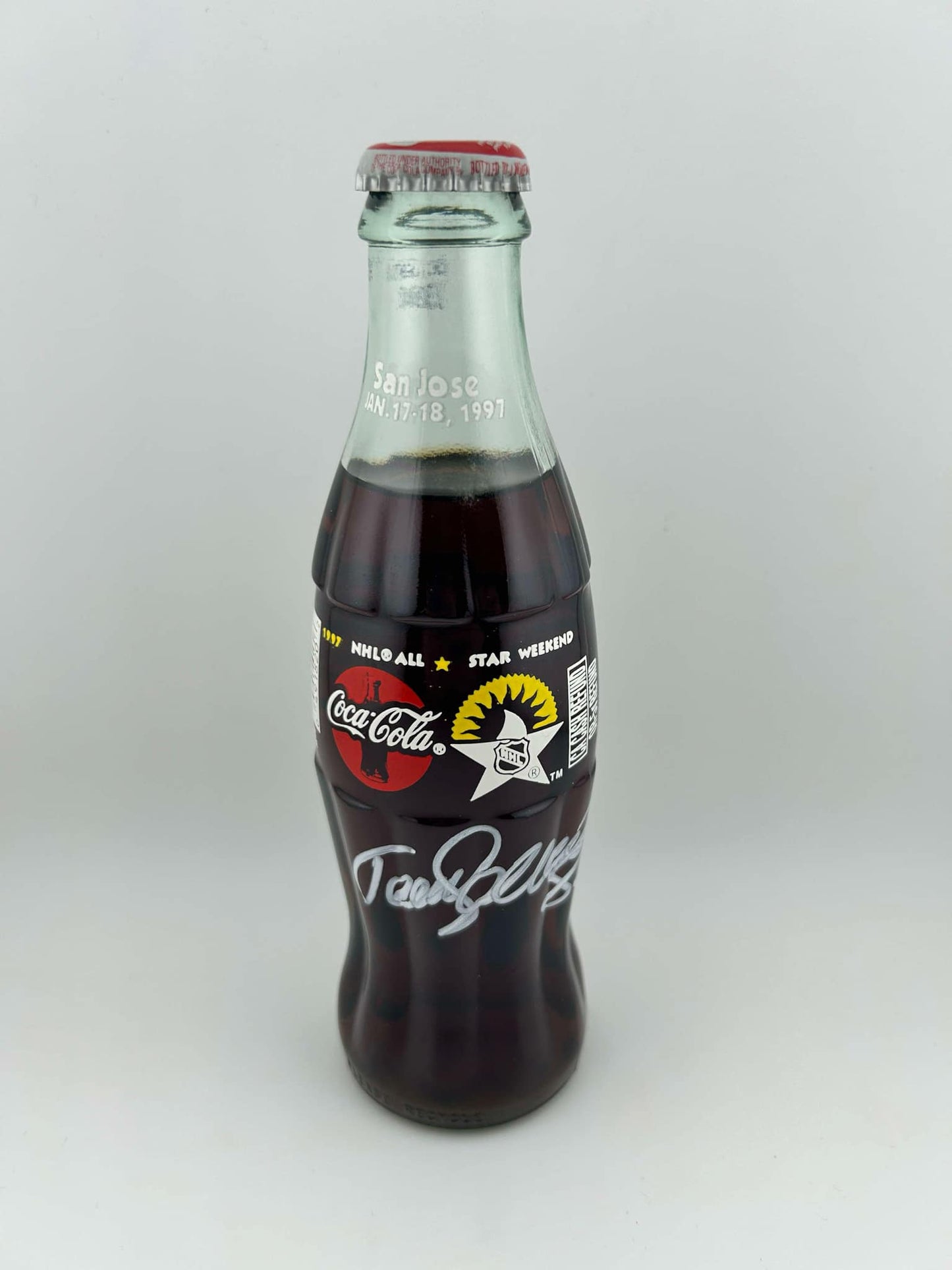 Teemu Selanne Anaheim Ducks Autographed 1997 NHL All Star Weekend Coca-Cola 80z Glass Bottle (unlopened) in white paint pen